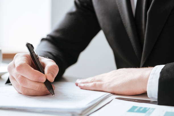 istock Cropped image of businessman writing notes. 1349191589