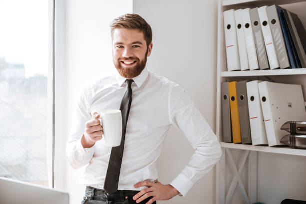 istock Happy young businessman looking at camera. 1349191783