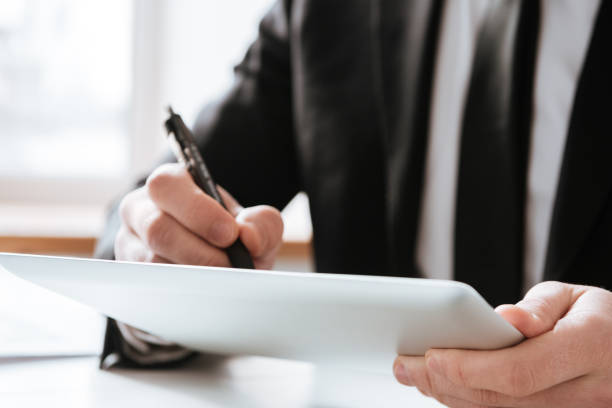 istock Cropped picture of businessman writing notes. 1349192116