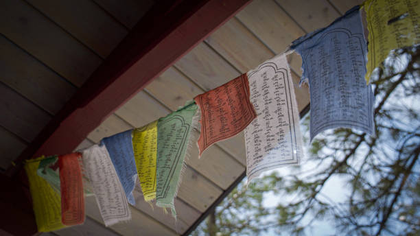 istock Buddhist prayer flags wave in the breeze on a sunny mountainside 1349192164