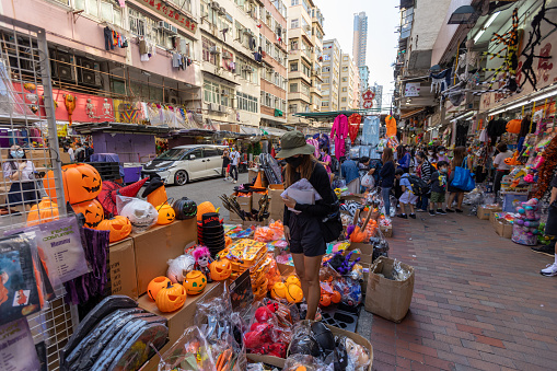 Hong Kong - October 26, 2021 : Market vendor selling decorations and costumes for the upcoming Halloween in Sham Shui Po, Kowloon, Hong Kong.