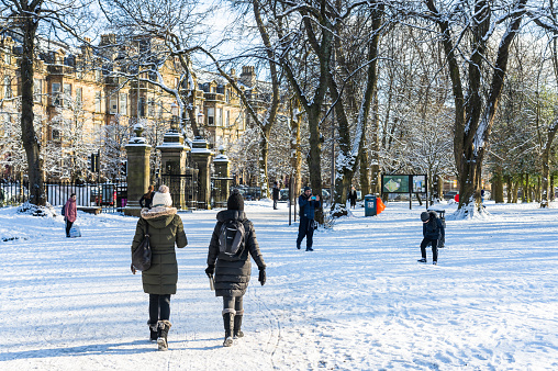 Glasgow, Scotland - People walking in Queen's Park in Glasgow's Southside after heavy snowfall.