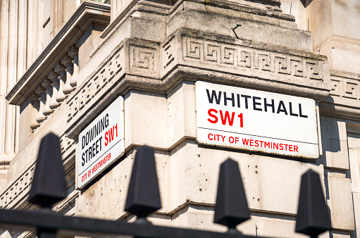 London, UK - Signs for Whitehall and Downing Street in Westminster, central London.