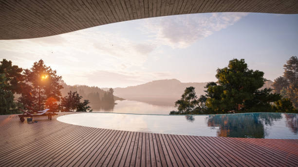 3D render of a resort swimming pool overviewing the scenery in the background. Poolside of a luxurious tourist resort with deck chairs on wooden flooring.