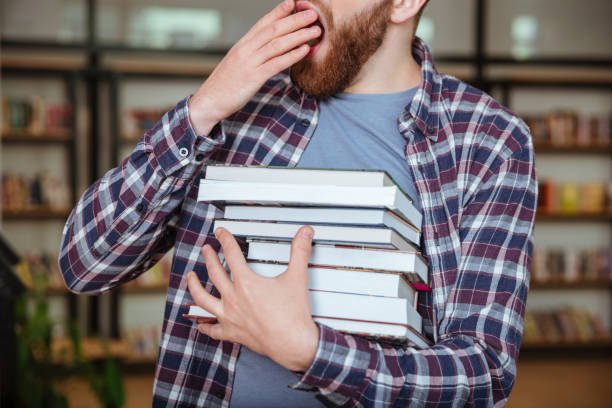 istock Cropped image of a tired bearded man yawning 1349196937