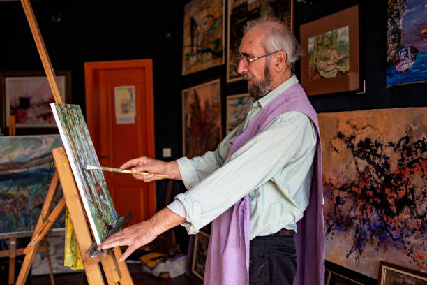 istock Senior artist painting 1349197299