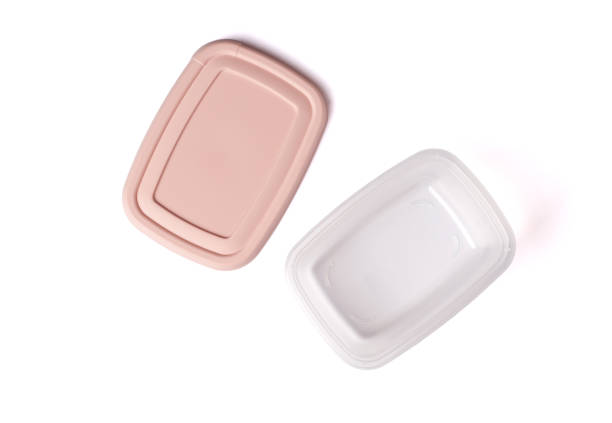 istock Open plastic food storage container with pink lid isolated on white background. Food box for lunch. Top view 1349198641