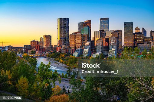 istock Sunset above city skyline of Calgary with Bow River, Canada 1349202956