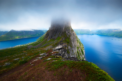 Fog covered Segla mountain on Senja island in northern Norway as seen from the Hesten trail