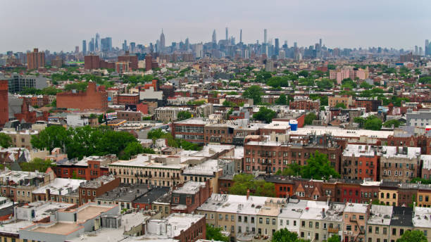 istock Aerial View Across Brooklyn Rooftops Towards Midtown Manhattan 1349203659