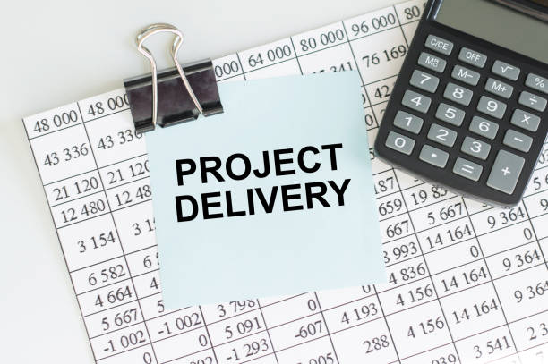 istock PROJECT DELIVERY word concept on sticker on the table 1349204298