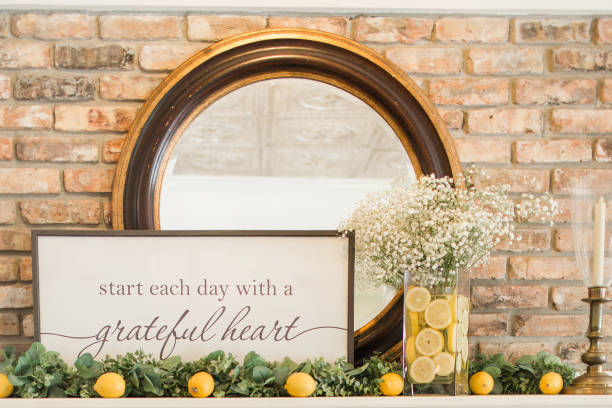 Simple Lemon, Eucalyptus & White Flower Baby Shower Decor With a Sign Saying "Start Each Day With a Grateful Heart" Simple Lemon, Eucalyptus & White Flower Baby Shower in South Florida. small florida home stock pictures, royalty-free photos & images