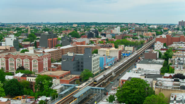 istock Subway Train on Tracks Above Atlantic Avenue in Brooklyn - Aerial View 1349205015