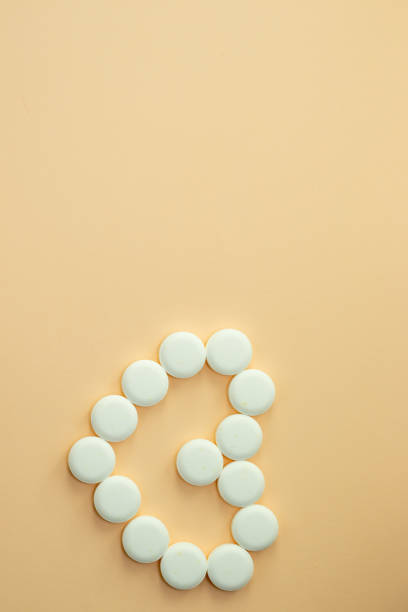istock Medication white round tablets in form of heart 1349205385