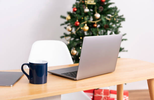 istock laptop computer on office table in christmas day.  Home office desk workspace. 1349209713