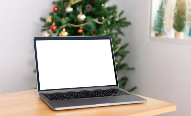 istock Mock up laptop computer with white screen on office table.  Home office desk workspace. Mock up copy space. 1349209746