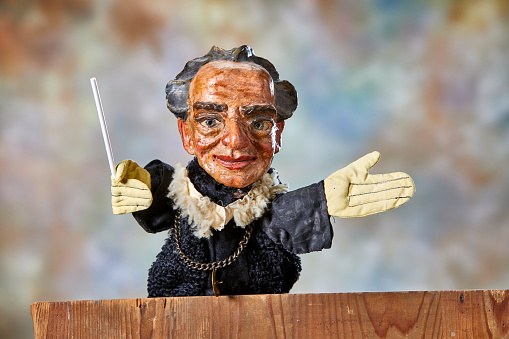 Vintage hand puppet from the 1930s, the conductor