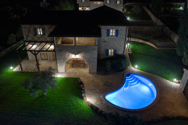 istock Luxurious beautiful modern villa with swimming pool and yard garden 1349210178