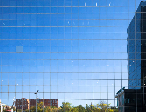 Reflections on the glass of a modern building