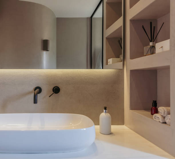 istock Bathroom sink basin and faucet modern interior design. Black taps and white washbasin, 1349210497