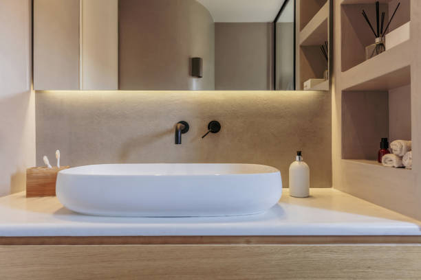 istock Bathroom sink basin and faucet modern interior design. Black taps and white washbasin, 1349210501