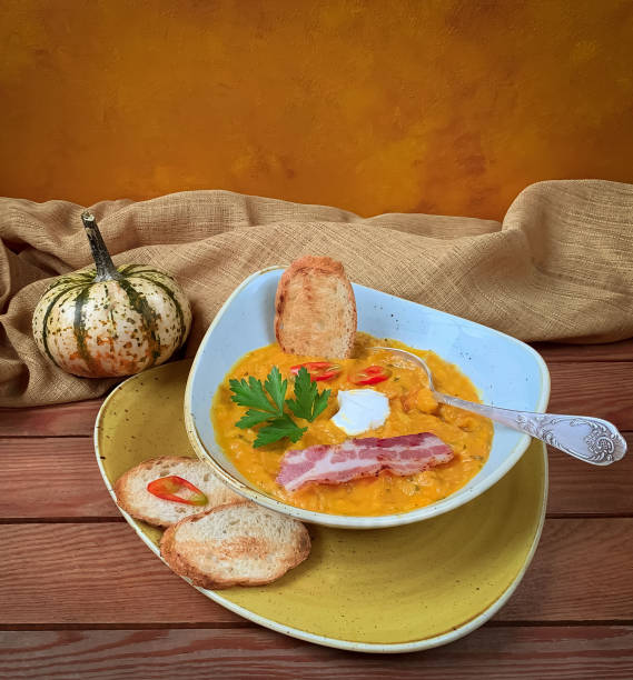 istock pumpkin soup with  decorative pumpkin 1349210564