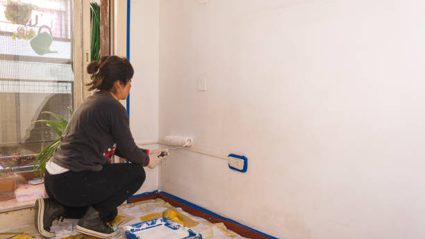 istock woman painting 1349214216