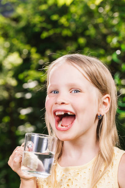 istock Child drinking water outdoors 1349214743