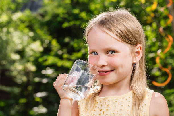 istock Child drinking water outdoors 1349215292