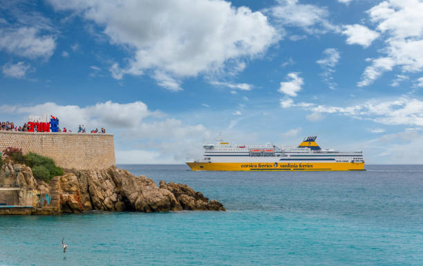 big yellow passenger ship operated by Corsica Ferries in Nice, France Nice, France - July 16, 2018: Mega Express four, big yellow passenger ship operated by Corsica Ferries Sardinia Ferries shipping company, arriving at the port of Nice corsican flag stock pictures, royalty-free photos & images