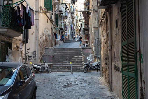 Naples, Italy, October 2021: View of the narrow busy streets in the Spagnoli district in the historic center in Naples, Italy.