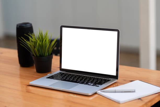 istock Digital tablet blank white screen with work equipment placed at the office desk. 1349217025