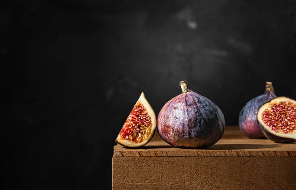 Ripe figs on a wooden box. Close-up, selective focus stock photo