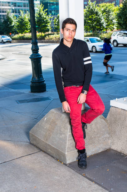 istock Young man standing outdoors in New York City, relaxing, thinking 1349218489