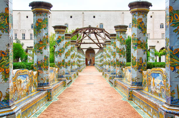Beautiful cloister of Santa Chiara, Naples, Italy Naples, Italy, October 2021: view of the beautiful cloister Santa Chiara. Santa Chiara is a religious complex in Naples, Italy, that includes the Church of Santa Chiara, a monastery, tombs and an archeological museum. medieval fresco stock pictures, royalty-free photos & images