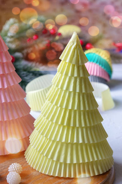 istock DIY openwork Christmas trees from a cupcake mold. Beautiful postcard for Christmas and New Year. 1349219662