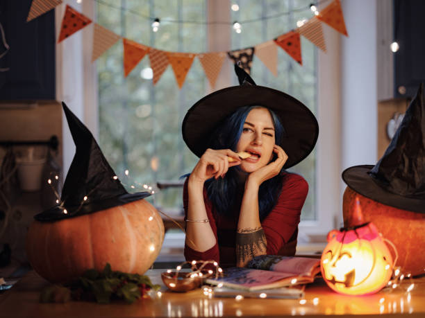istock All hallows eve. woman in witch costume 1349221084