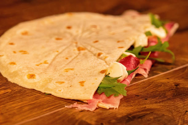 istock salty piadina with salami and vegetables 1349221212