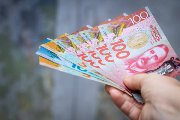 New Zealand dollars in hand New Zealand dollars in hand new zealand dollar photos stock pictures, royalty-free photos & images