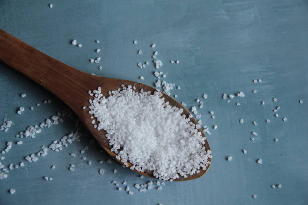 istock Sea salt in a wooden spoon isolated 1349222346