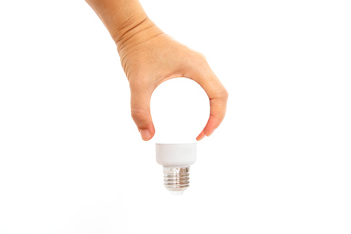Hand holding light bulb. idea concept with innovation and inspiration