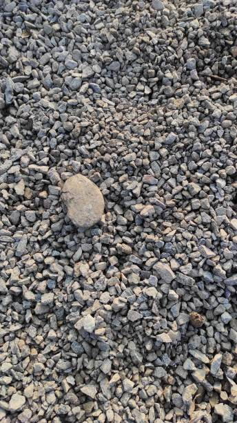 istock Grain of textured pebbles - stock photo 1349225155