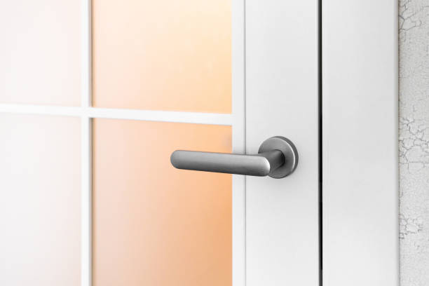 istock White door with grey door handle and glass 1349226125