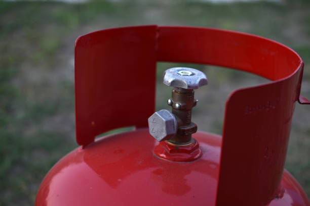 istock Red gas household bottle with shiny valve 1349226510