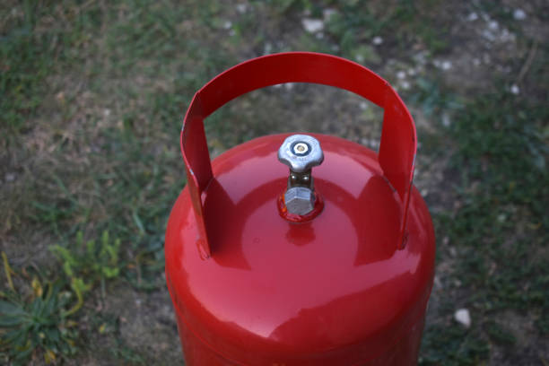 istock Red gas household bottle with shiny valve 1349226528