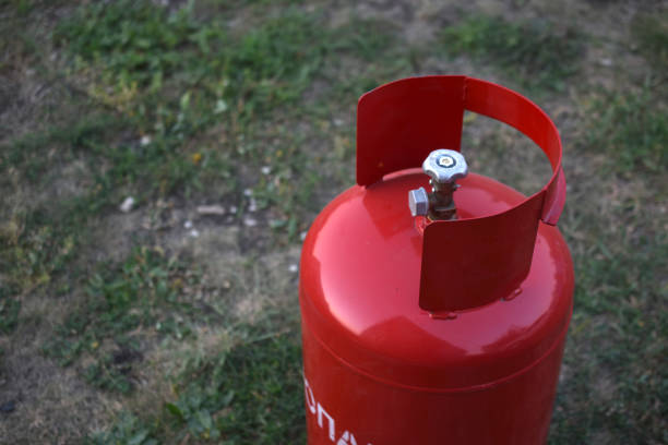 istock Red gas household bottle with shiny valve 1349226531