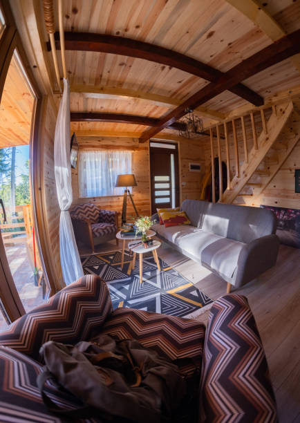 istock Cute bright log cabin in the mountains 1349227269