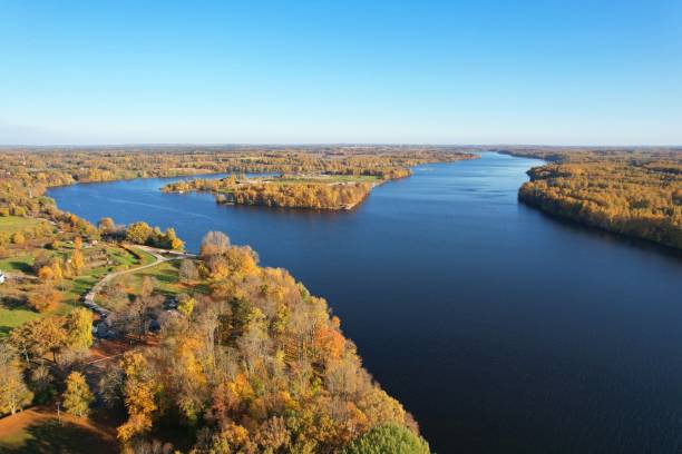 istock Aerial panoramic view of Daugava river surrounded by Autumn forest 1349227572