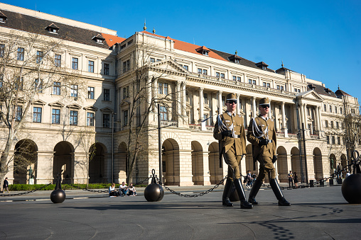 Supreme Court Building from budapest soldiers are on the building horizontal photo April 01,2017, Budapest, Hungary. The Curia of Hungary also known as the Supreme Court of Hungary before 2011 is the Supreme Court and highest judicial authority of Hungary. The Curia was founded in 1949 as the People's Republic of Hungary Supreme Court. It was preceded by the Royal Curia of the Kingdom of Hungary.