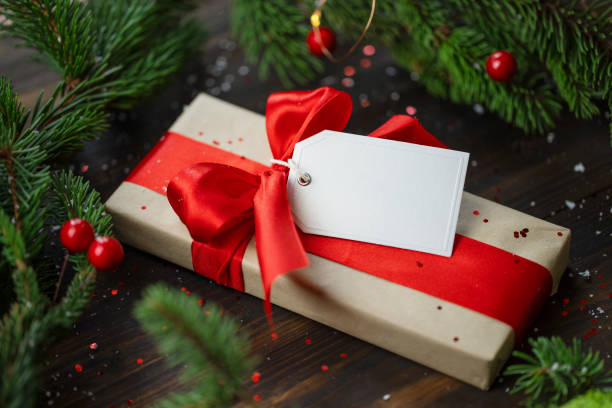 istock Christmas present with red ribbon and white label 1349229468